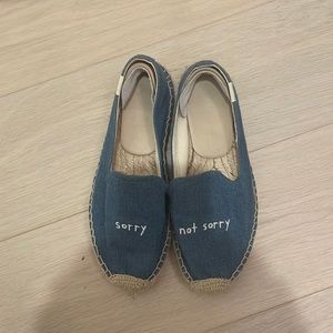 Barely worn Soludos with phrase “sorry, not sorry”